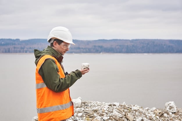 A geothermal engineer inspecting a wellhead at a geothermal power plant. The engineer is wearing safety gear, and the wellhead is surrounded by various pipes and valves. The background shows part of the power plant infrastructure and a clear sky.