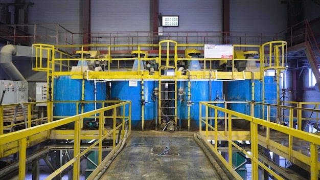 A technological view inside a hydrometallurgical recycling facility, showing labeled equipment such as leaching tanks, solvent extraction units, and precipitation reactors. The image should illustrate the chemical processes involved in separating and purifying rare earth elements from recycled wind turbine magnets.