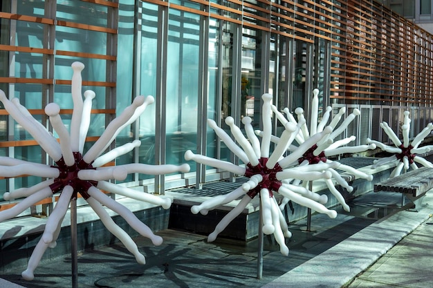 A close-up of a 3D printed wind turbine blade section undergoing testing in a wind tunnel, showcasing the detailed internal structure designed for optimal airflow and strength.