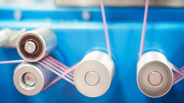 A close-up shot of a solid-state battery prototype in a laboratory setting. The battery is small and compact, with visible layers of solid electrolyte material. Scientists in lab coats are working meticulously in the background, highlighting the research and development efforts.