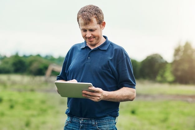 A farmer using a tablet to monitor real-time data from smart sensors in their field. The farmer is smiling and appears confident in their decision-making.