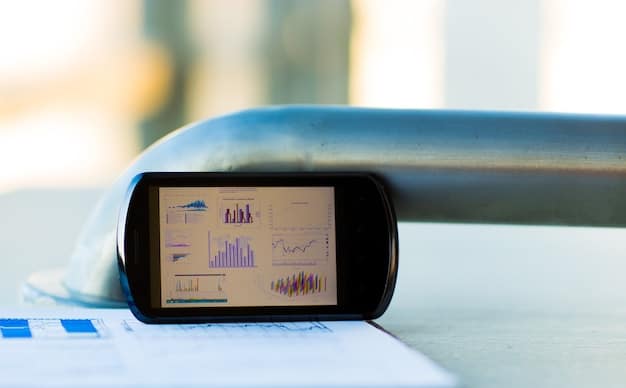 Close-up of a smart sensor attached to a pipe, displaying real-time data readings on a small screen. The setting is an industrial environment.