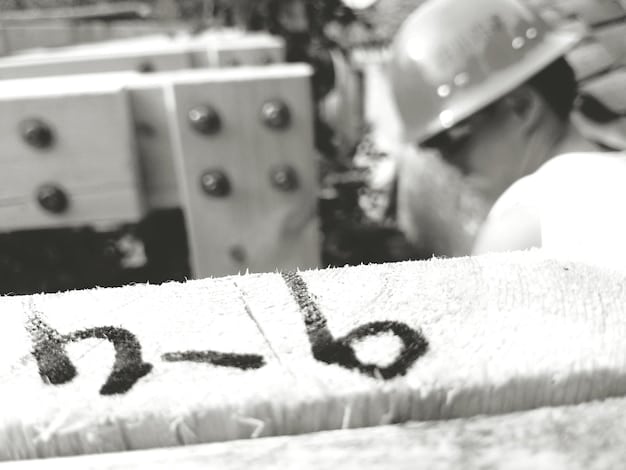 A close-up shot of carbon-negative concrete being poured on a construction site, with workers in safety gear overseeing the process. The concrete has a slightly different texture and color compared to traditional concrete.