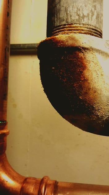 A split image showing an old gas pipeline with corroded fittings on one side, contrasted with a new, state-of-the-art pipeline with advanced monitoring sensors on the other side. The contrast highlights the need for infrastructure upgrades.