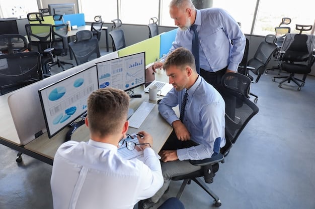 A team of engineers collaborating on a complex data analysis using multiple monitors, showcasing detailed simulations and performance metrics of a renewable energy system. The scene highlights collaboration and technological expertise in optimizing clean energy solutions, a critical aspect of effective DOE grant proposals.