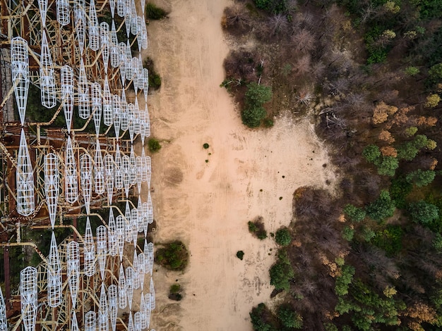 An aerial view of a carbon capture pilot project site in Texas, showcasing the integration of the facility with existing industrial infrastructure. Include storage tanks, pipelines, and the overall landscape of the surrounding industrial area.