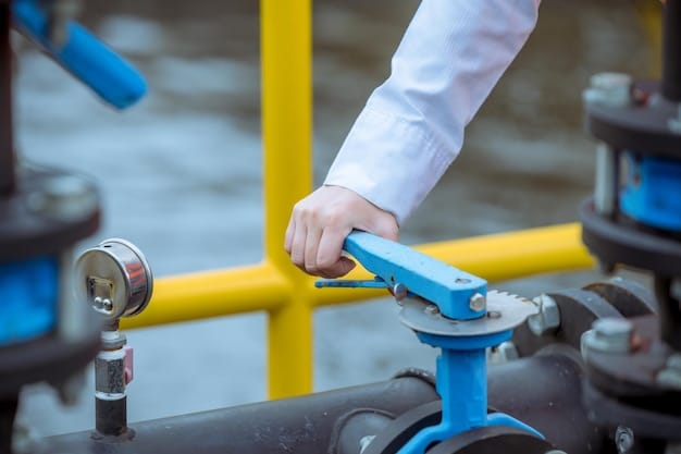 A worker inspecting a newly installed, modern valve on a natural gas pipeline. The valve is shiny and clean, contrasting with the older, weathered pipes around it. The worker is using a tablet to record data, indicating a thorough inspection process.