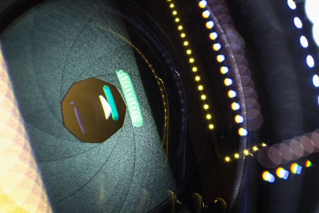 A close-up shot of an optical gas imaging (OGI) camera being used to detect a methane leak at a natural gas facility. The infrared camera reveals a plume of methane invisible to the naked eye. The image should highlight the precision and effectiveness of OGI technology.