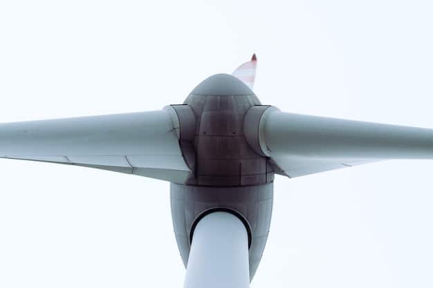 A close-up shot of a wind turbine blade made of advanced composite materials. The image highlights the texture and layering of the materials, with a focus on the structural integrity and lightweight design of the blade.