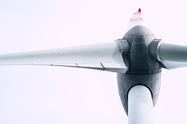 A detailed view of a wind turbine blade with serrated trailing edges. The image emphasizes the intricate design of the edges and how they disrupt the airflow to reduce noise.