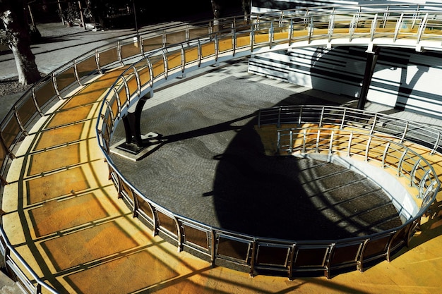 A close-up view of an anaerobic digester tank, showcasing its components and the connecting pipes. The image should highlight the technology and infrastructure involved in the process.