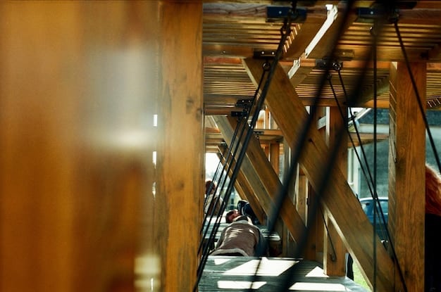 The interior of a building under construction using cross-laminated timber (CLT). The structural framework is visible, showcasing the large, wooden panels that form the walls and floors. Construction workers are present, and natural light streams through the partially completed structure, emphasizing the airy and sustainable nature of the building.