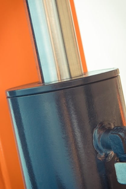 A close-up of a solar water heating panel on a rooftop, showing the internal components and fluid circulation. The image should highlight the energy-efficient technology and the collection of solar energy.