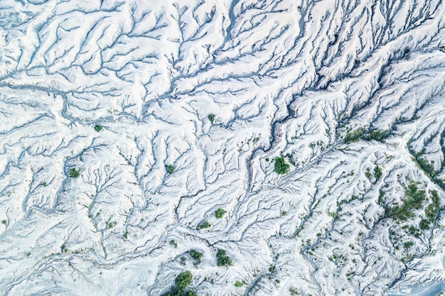A before-and-after satellite image showing the shrinking of a major glacier in Montana due to rising temperatures, highlighting the impact of climate change on natural landscapes.