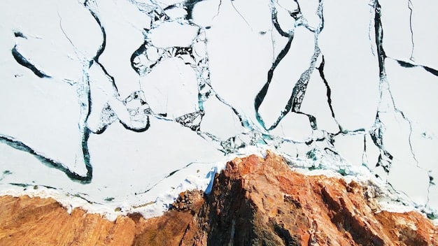 A close-up photograph of a rapidly melting glacier, with visible cracks and crevasses, highlighting the impact of climate change on these ice formations.
