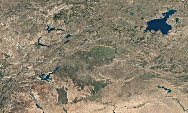 A satellite image of the Colorado River Basin, showing the diminishing water levels in Lake Mead and Lake Powell, two major reservoirs that supply water to the region.